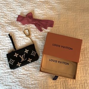 Louis Vuitton black coin purse. New in box never worn.